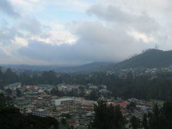 High angle view of townscape against cloudy sky