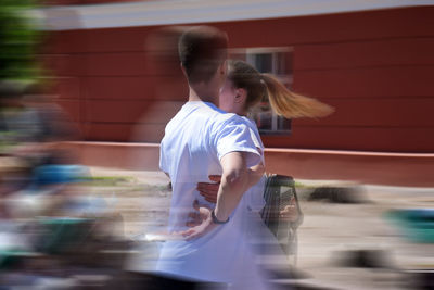 Blurred motion of man and woman dancing