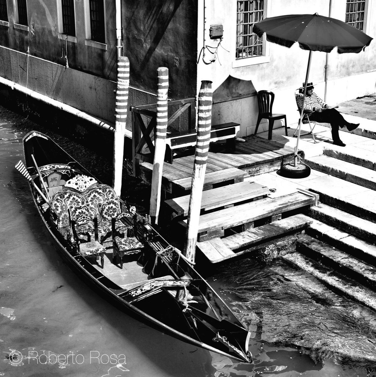 mode of transport, chair, transportation, nautical vessel, moored, boat, built structure, high angle view, building exterior, architecture, day, absence, seat, no people, outdoors, empty, wood - material, group of objects, relaxation, table