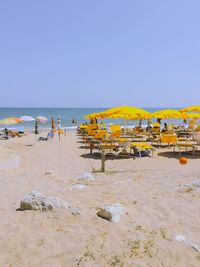 Scenic view of beach against blue sky