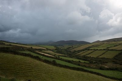 Scenic view of landscape against cloudy sky