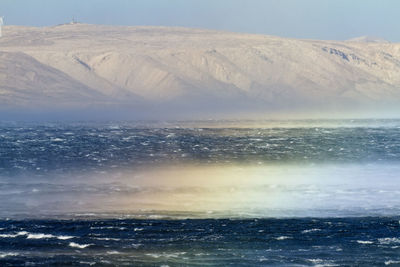 Rainbow on sea during bota wind