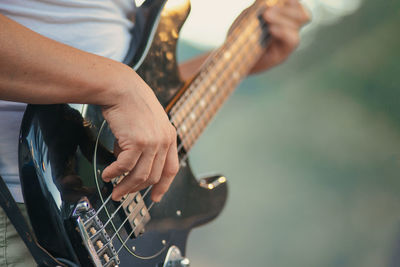 Detail of electric bass played during a show