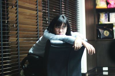 Mid adult man sitting in room