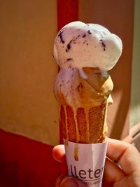 Close-up of hand holding ice cream