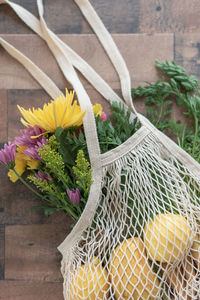 High angle view of flowering plant in basket on table