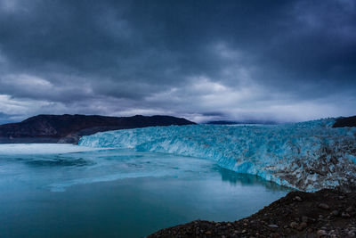 Scenic view of lake against sky during winter