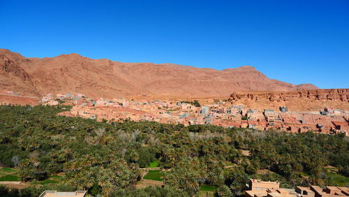 Scenic view of mountains against clear blue sky