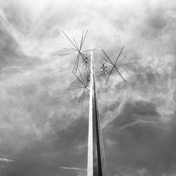 fuel and power generation, low angle view, sky, alternative energy, wind power, wind turbine, environmental conservation, technology, windmill, renewable energy, cloud - sky, electricity, cloudy, electricity pylon, power supply, cloud, power line, day, outdoors, nature