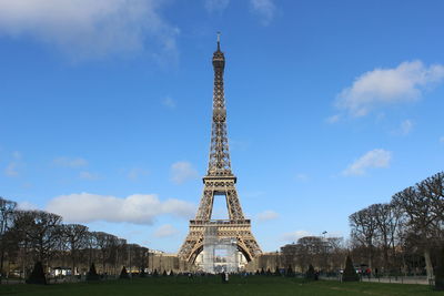 View of communications tower against cloudy sky