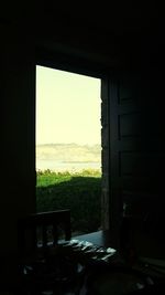 View of sea through window