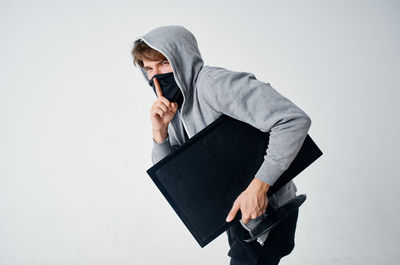 Man using smart phone against white background