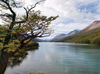 Scenic view of lake and mountains against sky