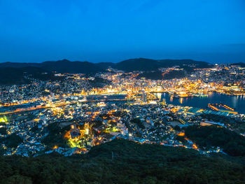 High angle view of illuminated buildings in city at night