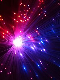 Defocused image of illuminated fireworks at night