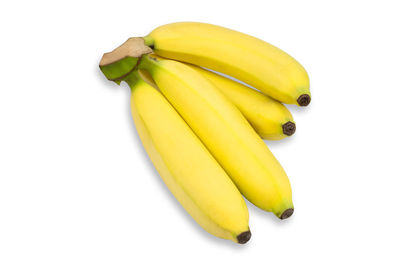 High angle view of yellow slices over white background