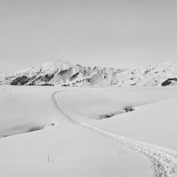 Scenic view of snowcapped mountains against sky