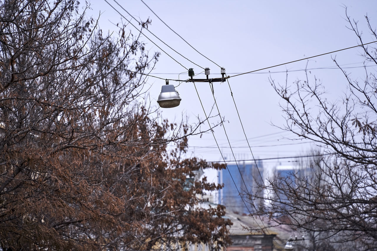 LOW ANGLE VIEW OF CABLES AGAINST SKY