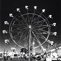 Low angle view of ferris wheel against sky