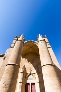 Low angle view of church against blue sky