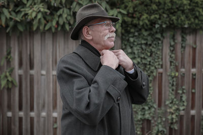 Portrait of man standing outdoors