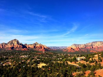 View of landscape against blue sky