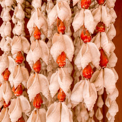 Close-up of christmas decorations hanging at market stall