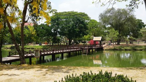 Scenic view of bridge over lake against sky