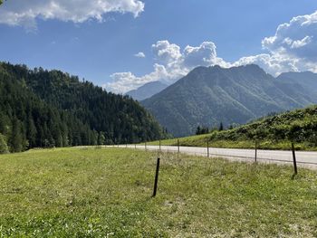 Scenic view of landscape and mountains against sky