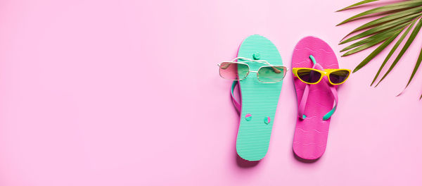 High angle view of sunglasses against colored background