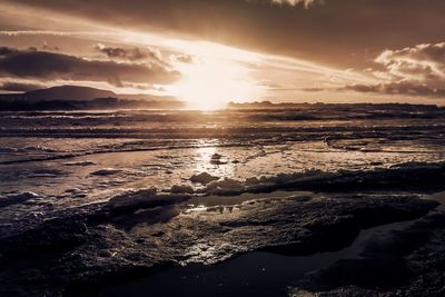 Scenic view of sea at sunset