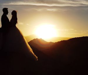 Silhouette mountains against sky during sunset