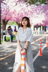 Portrait of a young woman standing outdoors