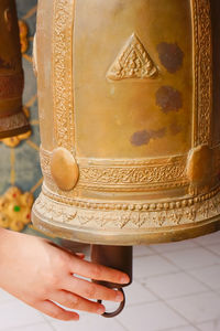 Close-up of woman holding statue