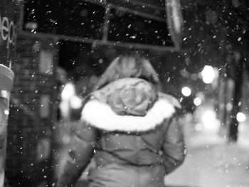Close-up portrait of a girl in snow