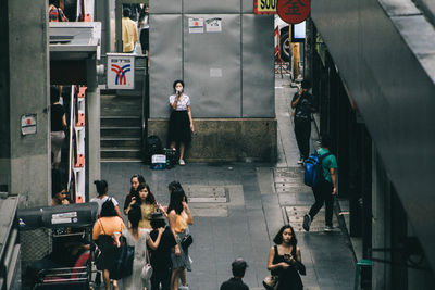 High angle view of people walking at railroad station