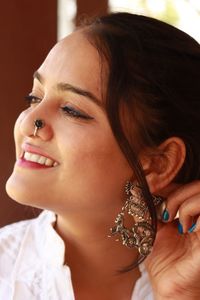 Close-up portrait of a young woman looking away