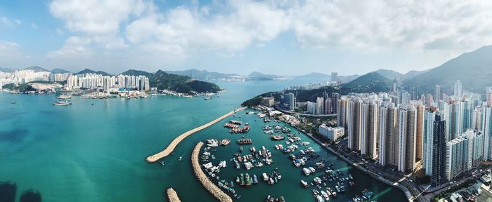 Panoramic view of sea and buildings against sky