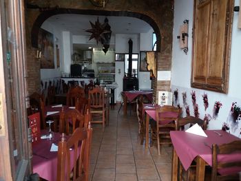 Empty chairs and tables in cafe