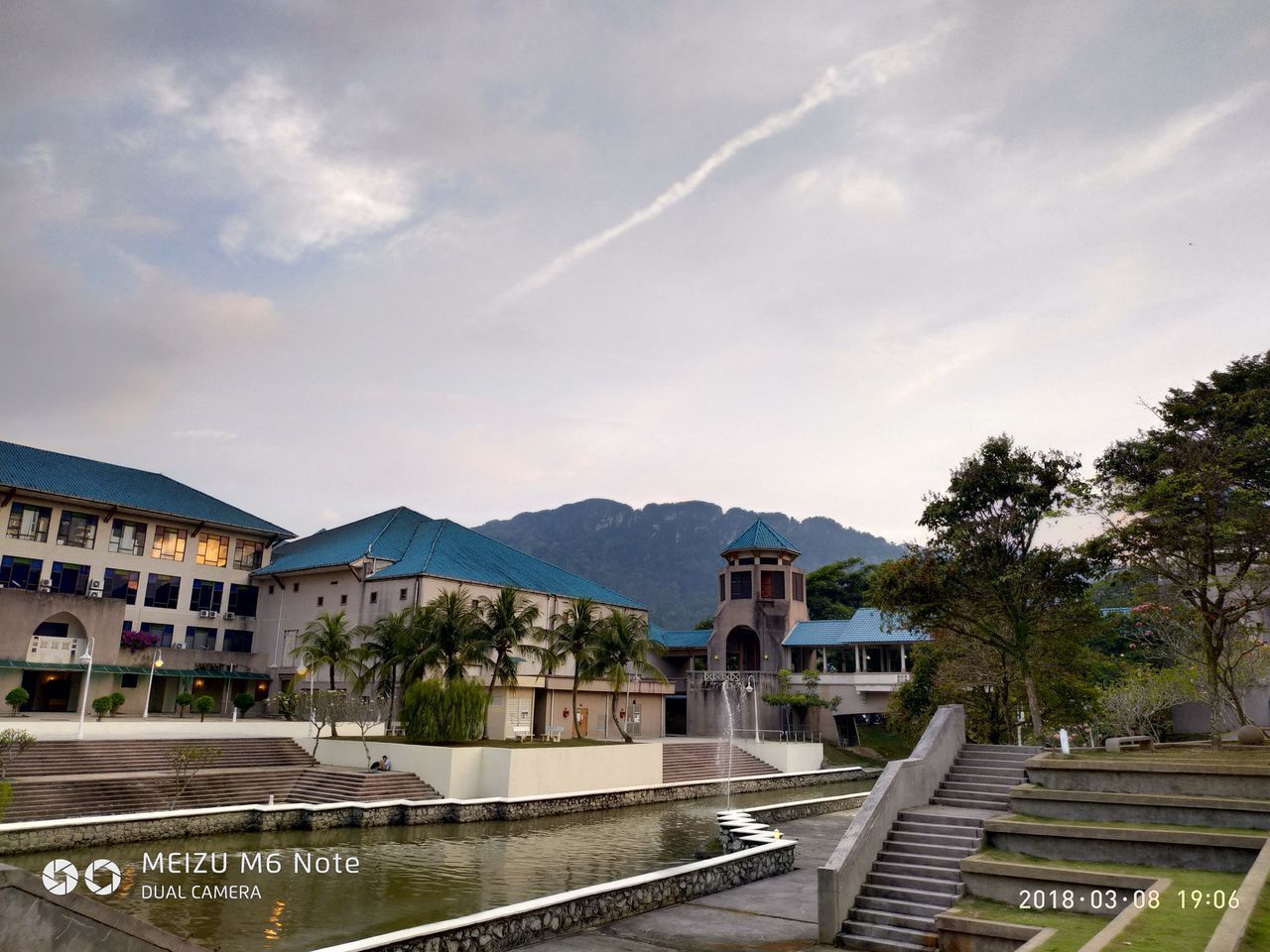 BUILDINGS AGAINST MOUNTAIN RANGE