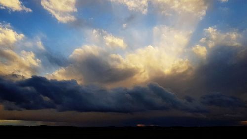 Low angle view of cloudy sky during sunset