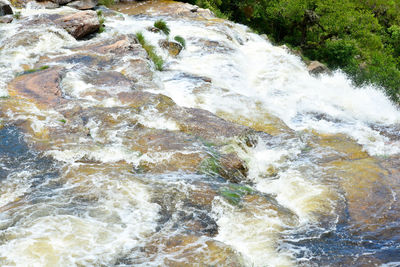 Water flowing through rocks in sea