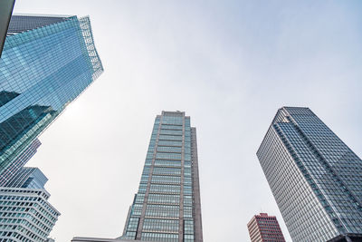 Low angle view of modern buildings against sky in city