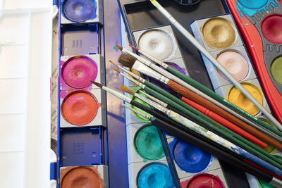 High angle view of paintbrushes in container