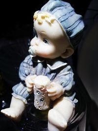 Close-up of hand holding cake