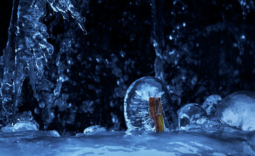 Frozen waterfall in forest during winter