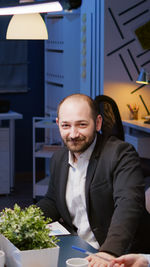 Portrait of businessman sitting at office