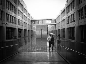 Full length of couple walking in rain