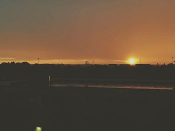 Scenic view of silhouette landscape against clear sky during sunset