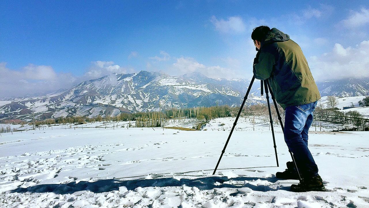 snow, winter, cold temperature, season, mountain, weather, leisure activity, snowcapped mountain, sky, lifestyles, landscape, warm clothing, mountain range, tranquil scene, covering, tranquility, beauty in nature, nature